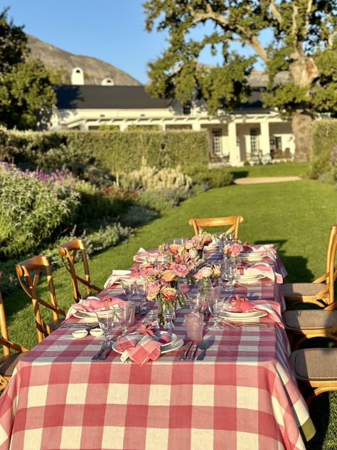 A new colour of our chunky check Gingham has just arrived with us!⁠ ⁠ In a romantic rose pink framed by a gorgeous green trim, the collection is inspired by a perfect summer. Dappled light dances across the table as you and your guests while the hours away, with delicious fresh food and the company of loved ones. Time goes happily slower at the table...⁠ ⁠ The collection is available as a tablecloth, in three sizes, with a matching napkin, all on 100% pure French linen. ⁠ ⁠ Love,⁠ S&B⁠ Pink Gingham Table Setting, Gingham Tablecloth Setting, Pink Gingham Farm Party, Pink Plaid Table Cloth, Yellow Gingham Table Setting, Pink Tablescape, Bbq Table, Dappled Light, Pink Frames