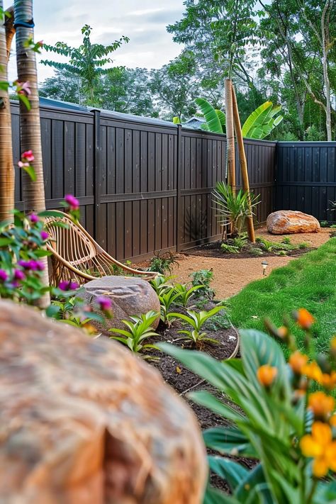 Tranquil garden scene with a pathway, lush plants, colorful flowers, large rocks, and a wicker chair, all framed by a tall, dark wooden fence. Easy Diy Fence, Fence Ideas Privacy, Backyard Fence Ideas Privacy, Backyard Fence Ideas, Wood Fence Ideas, Cascading Plants, Backyard Privacy Screen, Diy Backyard Fence, Diy Privacy Screen