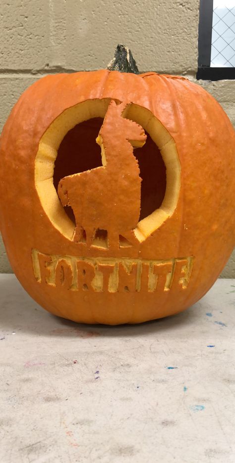 Fortnite carved pumpkin Pumpkin Carving Ideas Fortnite, 9th Birthday Party Themes, Fortnite Pumpkin Carving, Fortnite Pumpkin, Carvings Designs, Fortnite Halloween, Halloween Pumpkins Carvings Designs, Pumpkin Carving Art, Halloween Pumpkin Crafts