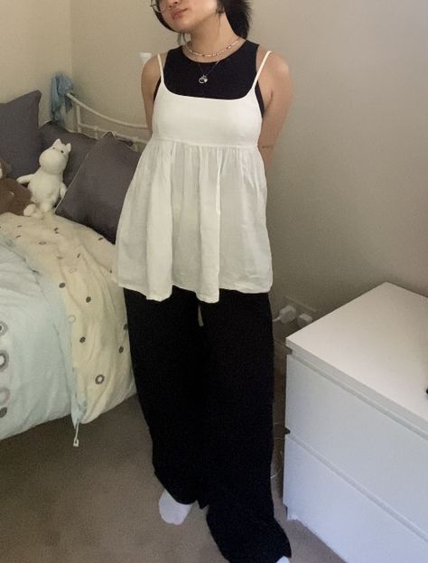 Black tank top and black wide leg formal trousers layered on top with a white baby doll top spring autumn summer outfit Babydoll Tank Top Outfit, Doll Top Outfit, Baby Doll Top Outfit, Babydoll Tank Top, Baby Doll Top, Tank Outfit, Babydoll Tank, Formal Trousers, Tank Top Outfits