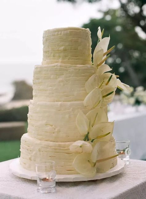 This wedding cake definitely has an island feel, with buttercream ruffles to set the tone. Topped with cascading florals from a peace lily, this design is perfect for a classic tropical wedding. Head to the link for more beach wedding cakes we love. // Photo: Norman & Blake and Cake: Angela Michel Anthurium Wedding Cake, Key Lime Wedding Cake, Beach Wedding Cake Ideas, Beach Wedding Cakes, Beach Wedding Color Palette, Pistachio Buttercream, Chocolate Crumble, Lime Curd, Unique Wedding Cake