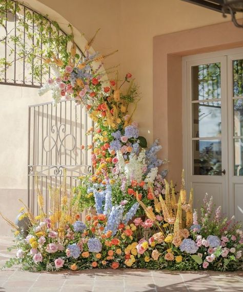 Rainbow Garden Wedding, Fairytale Wedding Florals, Colorful Floral Arrangements Wedding, Colorful Flower Arch, Colorful Arch Wedding, Disney Wedding Flowers, Eccentric Wedding Decor, Wedding Flower Installations, Wild Flower Wedding Theme Color Schemes