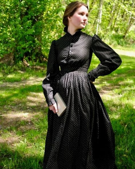 "Antique Victorian black with white dot calico dress. Ruffled band neck collar, puffed sleeves, ruffled cuffs, and button front bodice. Bodice and sleeves are fully lined in brown cotton. Black jet buttons with hand stitched button holes. Fitted waist with tightly gathered back and lightly gathered front. Skirt is unlined. Condition is excellent with the top button being different than the others. No other flaws were found. Hand washed and ready to wear. Fit is an extra-small. Model wear a size Sewing A Victorian Dress, Victorian Historybounding, Victorian Outfits Women, Victorian Day Dress, Black Victorian Dress, Victorian Fashion Women, Working Dresses, Calico Dress, Farm Dress