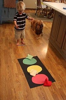 Stoplight Beanbag Toss.  let your little one try to toss the beanbag onto the corresponding color while it is laying down flat (with an underhand throw). Pick up the stoplight and hold it upright against you.  Have your child try to throw the beanbags overhand to hit the corresponding color. Structured Play, Beanbag Toss, Transportation Unit, Transportation Preschool, Transportation Theme, Bean Bag Toss, Bag Toss, Community Helpers, Toddler Fun