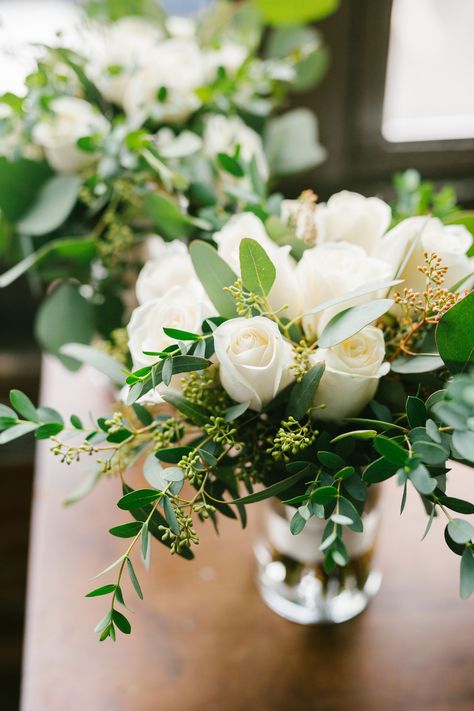 White and green wedding flowers; white roses and greenery; simple wedding flowers; elegant flowers;   Lisa Foster Floral Design  www.lisafosterdesign.com White And Green Flower Arrangements Simple, White Floral Centerpieces Simple, White Roses Greenery Bouquet, White And Green Flower Arrangements For Table, Simple Green Wedding Centerpieces, Simple Wedding Arrangements, White Roses And Greenery Centerpiece, White Flowers And Greenery Centerpieces, White And Greenery Floral Arrangements