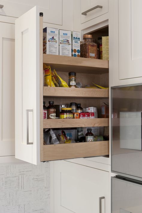 Pull-out spice rack beside wall ovens with height to allow space for spices and dry goods of all varieties. #KitchenStorage #KitchenOrganization #FunctionalKitchens #SpiceRack #OrganizeThoseSpices Custom-built by Chervin Kitchen & Bath. Upper Cabinet Spice Storage, Upper Cabinet Spice Pullout, Upper Spice Cabinet, Kitchen Spice Rack Ideas, Custom Pantry Ideas, Spice Rack Ideas, Wall Mounted Kitchen Shelves, Pull Out Spice Rack, Kitchen Spice Rack