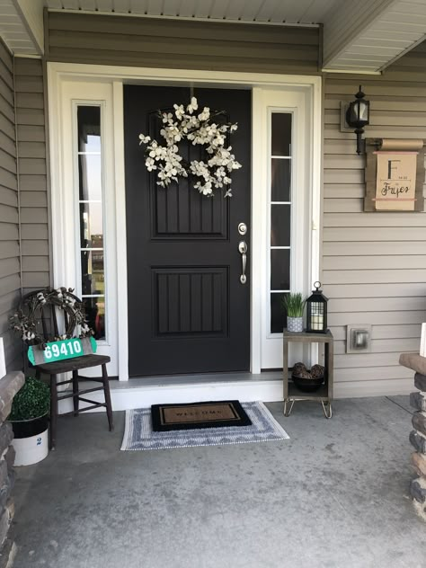 Front Door Trim Exterior Entrance, Black Farmhouse Exterior Door, Black Door Outside, Exterior Porch Lights Front Entrances, Front Door Farmhouse Entrance, Front Door Black House, Black Front Door Tan House, Farmhouse Front Door With Side Lights, Black Door Exterior Front Entry