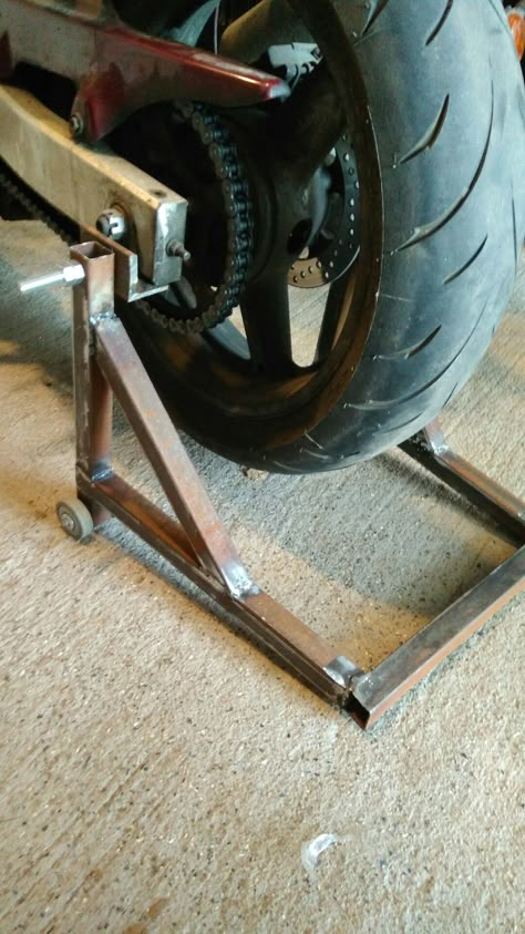 DIY motorcycle stand Motorcycle Stand Diy, Motorcycle Lift Table, Metal And Wood Bench, Homemade Motorcycle, Motorcycle Stand, Diy Tools Homemade, Cafe Racer Parts, Motorcycle Storage, Machining Metal Projects