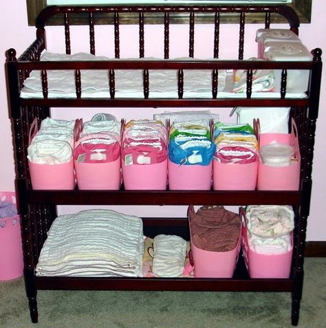 Plastic totes instead of bins (narrower). Found these at Dollar Tree for school at one point. Daycare Diaper Organization, Diaper Storage Ideas, Cloth Diaper Storage, Preschool Organization, House Diys, Dollar Store Bins, Cheap Baby Clothes, Diaper Storage, Diaper Changing Station