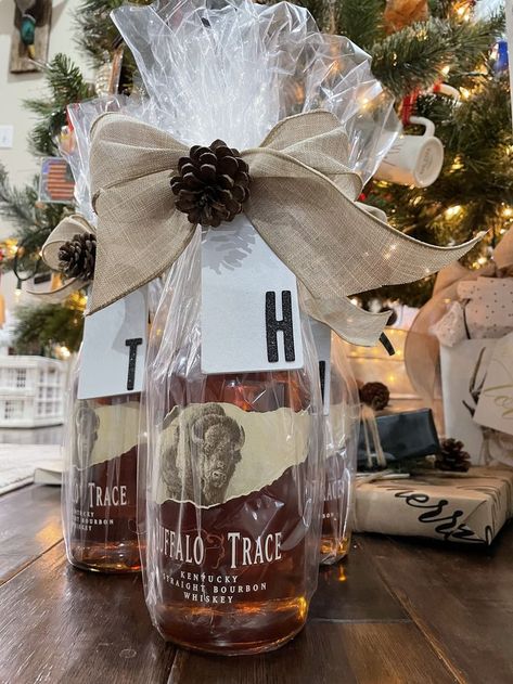 Whiskey: A gift that keeps on giving! Add some celephane and a bow for a quick Christmas Flair! Gift Wrap Liquor Bottle Ideas, Whiskey Christmas Gift, How To Gift Wrap Bourbon Bottle, Wrapping Whiskey Bottle, Wrap Liquor Bottle Gift, Celephane Wrapping, Wrapping Alcohol Bottles Gift, Whiskey Gift Basket, Bourbon Gifts Basket