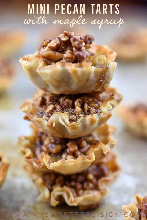 These mini pecan tarts are decadent and delicious. Made with phyllo shells and maple syrup, they are the perfect bite-sized appetizer or dessert for your next party. The crunchy pecans and gooey filling are reminiscent of a pecan pie but with fewer calories! Pecan Phyllo Cups, Appetizer With Phyllo Shells, Maple Pecan Tassies, Pecan Pie Phyllo Tarts, Pecan Pie Phyllo Cups, Phyllo Cup Dessert Recipes, Mini Pecan Pies In Phyllo, Phyllo Tart Recipes, Mini Pecan Phyllo Tarts