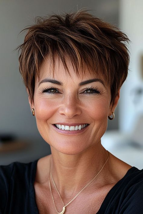 Rich Brown with Hints of Auburn Pixie, low-maintenance choppy pixie haircut for women over 50 Brown Hair Pixie Haircut, Short Hairstyles For Women Over 50, Funky Short Hair Over 50, Choppy Pixie Haircut, Auburn Pixie, Haircut For Women Over 50, Pixie Haircut For Women, Pixie Cut With Highlights, Choppy Pixie