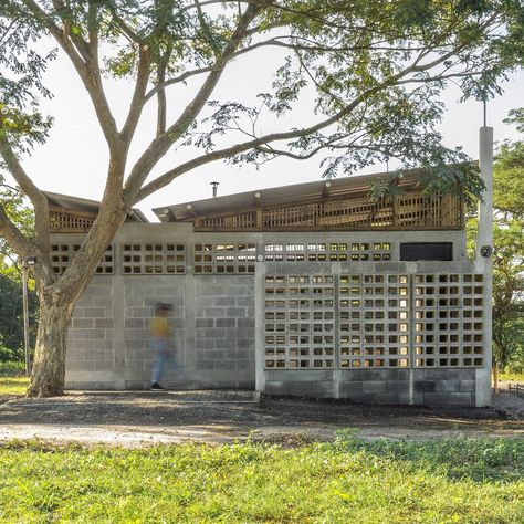 DEOC Arquitectos adds yellow paint to cinder blocks for emergency shelter in Guatemala Breeze Block Wall, Masonry Construction, Public Toilet, Breeze Blocks, Guatemala City, Tropical Architecture, Emergency Shelter, Japanese Architect, Public Restroom