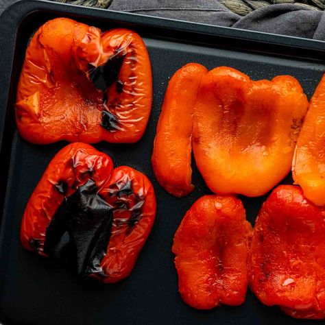 Easy instructions for how to roast peppers in the oven to make delicious roasted red peppers to use in salads, soups, sauces, and sandwiches. Roasting Green Peppers In Oven, Red Pepper Roasted, Roasting Bell Peppers In Oven, Baked Peppers Oven, Roasting Red Peppers In Oven, Oven Roasted Red Peppers, Roast Bell Peppers In Oven, Roast Red Peppers In Oven, How To Roast Red Peppers