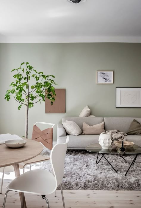 Green And Grey Walls Living Rooms, Light Green Living Room Decor Ideas, Sage Green Living Room Grey Sofa, Mint Green And Beige Living Room, Mint Green Wall Living Room, Mint Wall Living Room, Light Green Grey Living Room, Light Green Family Room, Mint Green House Interior Design