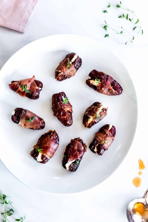 Coated in a slightly spicy maple glaze, our prosciutto wrapped dates are stuffed with goat cheese and thyme and ready to eat in just 10 minutes! These little appetizers are incredibly easy to make and sure to impress! #mapleglazed #stuffeddates #appetizer #easyappetizer #goatcheese #prosciutto Blueberry Goat Cheese, Bacon Wrapped Dates, Healthy Italian, Make Ahead Appetizers, Date Recipes, Bite Size Appetizers, Maple Glaze, Fruit Salad Recipes, Date Dinner