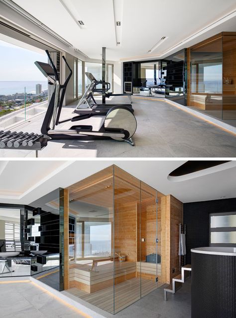 In this modern home gym, there's a spa bathroom with a sauna and chiller bath. Mirrors above a vanity reflect the view outside. #ModernHomeGym #Sauna #ModernGym Exercise Room With Sauna, Home Gym And Spa, Home Gym Modern, Sauna Plunge Inside Garage Gym, Indoor Pool And Gym, Pool House With Gym And Sauna, Gym Modern, Gym And Spa Plan Architecture, Bath Mirrors