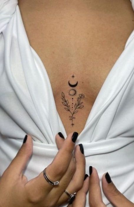 30 Sexy Sternum Tattoos For Women - The Trend Spotter Side Tummy Tattoo, Mahalo Tattoos, Breast Bone Tattoos For Women, Delicate Chest Tattoo Female, Simple Chest Tattoos Female, Tattoo Middle Of Chest Women, In Between Chest Tattoo For Women, Rippen Tattoo Frau, Small Sternum Tattoo Women