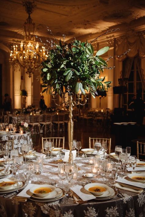 Tall Mixed-Greenery Centerpieces on Gold Candelabras Candleabra Wedding, Candelabras Wedding, Champagne Wedding Cakes, Greenery Centerpieces, Table Floral Arrangements, Candelabra Wedding, Gold Candelabra, Candelabra Centerpiece, Greenery Centerpiece