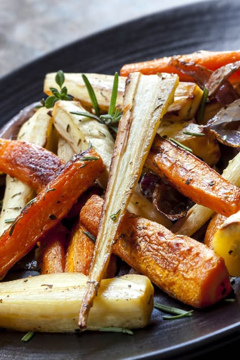 Oven-Roasted Carrots, Turnips, And Parsnips - For an added touch, add some chopped herbs (we like rosemary) to the oil before roasting the vegetables. Make sure the vegetables are cut to uniform size so they cook evenly (no one likes an overcooked turnip!). | CDKitchen.com Turnips And Parsnips Recipe, Ways To Cook Vegetables, How To Cook Turnips, Parsnips Recipe, Vegetables In Season, Roasted Turnips, Roasted Carrots And Parsnips, Root Vegetables Recipes, Parsnip Recipes