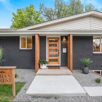 Exterior Paint Modern House, Midcentury Modern Exterior Door, Dark Gray Mid Century Modern Exterior, White Midcentury Modern House Exterior, Painted Brick Mid Century Modern, Mid Mod Exterior Makeover, Midcentury Modern House Exterior Colors, Mid Century Flat Roof House, Mcm Ranch Exterior