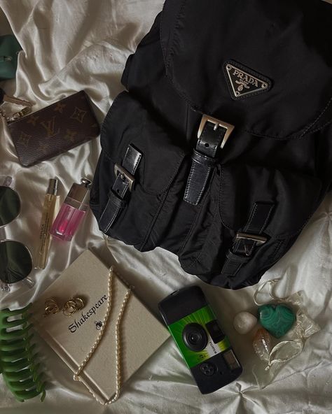 What’s in my bag Prada camera dior lip Louis Vuitton key pouch books jewelry gold black crystals clean girl aesthetic Prada Backpack Outfit, Loafers Outfits, Johnny Edlind, Bag Wishlist, Everyday Bag Essentials, Skull Handbags, Prada Backpack, Long Black Maxi Dress, Aesthetic Backpack