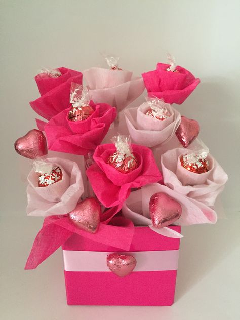 Pink Lindt bouquet! $30 Other colours can be done.  10 Lindt chocolates 5 Cadbury heart chocolates  Private message to order! Lindt Gift Ideas, Lindt Bouquet, Lindt Chocolate Gift Ideas, Mini Chocolate Bouquet, Lindt Chocolate Bouquet, Flowers For Valentines, Chocolate Flowers Bouquet, Flowers For Valentines Day, Chocolate Bouquet Diy