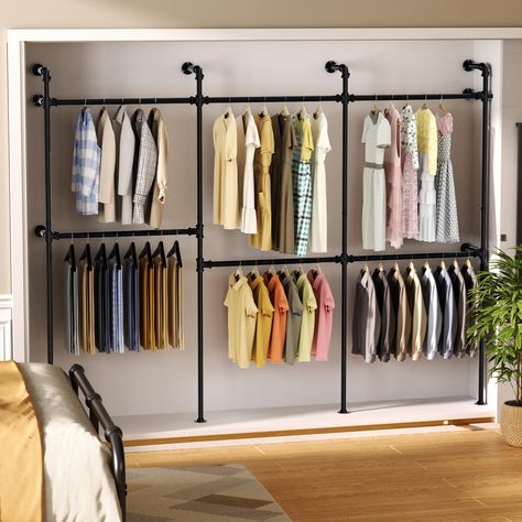 PRICES MAY VARY. Durable & Long-lasting: This industrial pipe clothing rack is made of high-quality iron pipes and electroplated with a protective coat to enhance corrosion resistance and prevent rusting. It's strong, stable, and designed for long-term use. The adjustable hanging bars can be moved up or down to fit different clothing lengths, providing extra convenience. Widely Used: This black wall clothing rack is versatile and can be used in many ways—whether as a walk-in closet in the bedroo Black Clothing Rack, Pipe Closet, Clothes Storage Systems, Industrial Clothing Rack, Wall Mounted Clothing Rack, Shelves Closet, Rack Closet, Standing Closet, Industrial Clothing