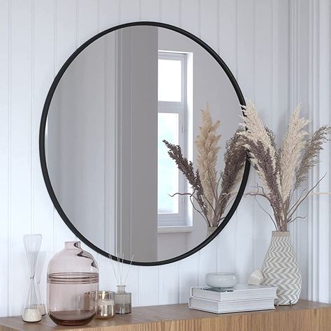 Give any room in your home an instant refresh with this round wall mount mirror. The modern design boasts a slim, matte black metal frame that lends an up-to-date look to almost any decor. HD glass with real silver backing provides high reflectivity for a distortion-free image. Safety should always be first, especially in environments with children and pets. Shatterproof backing technology ensures the glass stays put in the frame when breakage occurs to prevent cuts. The waterproof and rust-r... Black Circle Mirror, Circle Mirror Wall, Vanity Living Room, Mirror For Entryway, Minimalist Mirror, Black Round Mirror, Minimalist Mirrors, Large Round Mirror, Circle Mirror