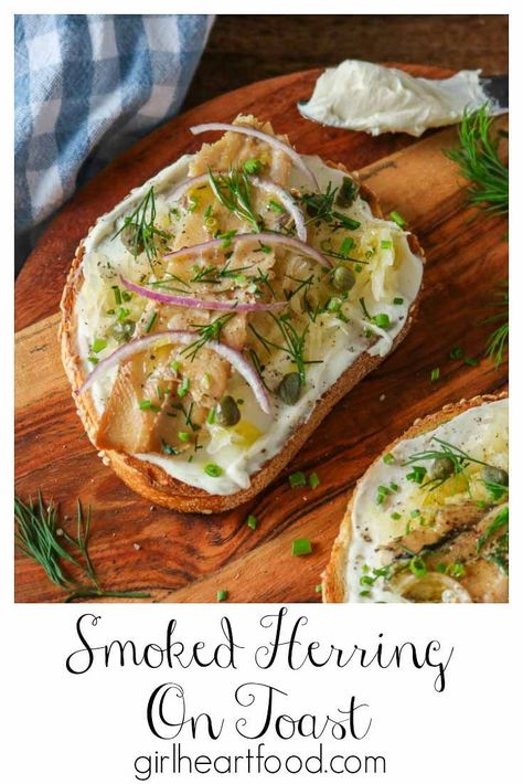 Fan of smoked herring? This recipe for smoked herring on toast is incredibly easy to prepare and comes together quickly. With a cream cheese base, sauerkraut, smoked herring, capers, onion, chives and dill, it's super tasty and makes for such a delicious lunch or snack. #smokedherring #smokedherringrecipe #herringontoast #openfaceherringsandwich #fishontoast #cannedfishrecipe #tinnedherring #cannedherring Kippered Herring Recipe, Smoked Kippers Recipes, Kipper Snacks Recipes, Smoked Herring Recipe, Vegetable Quesadilla, Toast With Cream Cheese, Smoked Herring, Herring Recipes, Meatless Mains