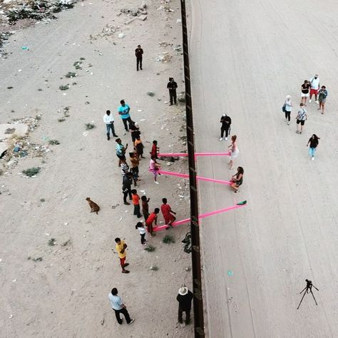 Like something out of a fairytale, a set of shocking pink seesaws sprang up right in the middle of the United States border wall with Mexico. Quite