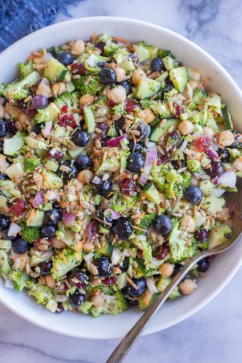 This Broccoli Blueberry Salad with Chickpeas is tossed with a refreshing lemon poppyseed dressing and perfect for all your summer get togethers! It's easy to make and tastes delicious, even a day or two after so you can make it ahead of time. Make sure to save this Broccoli Blueberry Salad recipe for all your summer potluck and BBQ needs! #broccolisalad #lemonpoppyseed #summersalad #bbqside #veganrecipe Broccoli And Cucumber Salad, Broccoli Blueberry Salad, Salad For Cookout, Broccoli Chickpea Salad, Make Ahead Sides, Lemon Poppyseed Dressing, Blueberry Salad Recipes, Raw Salads, Summer Potluck Recipes