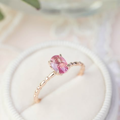 One of a kind (only 1 ring available in each gold color) unheated natural pink sapphire ring is made of 100% recycled 14k gold with a choice of solid 14k yellow, rose, and white. The ring features clean and sparkly unheated natural unheated purple sapphires, perfect to wear on a special occasion or as a unique engagement ring. 7x5mm approx. 0.4ct unheated natural pink or purple sapphire (not synthetic, not lab created) Band width: approx. 1.5mm High profile four prongs flower setting Made with 1 Pink Sapphire Wedding Band, Sapphire Birthstone Ring, Candy Ring, Gorgeous Rings, Pink Sapphire Ring Engagement, Sapphire Birthstone, Sapphire Wedding Band, Spring Breeze, Pink Tourmaline Ring