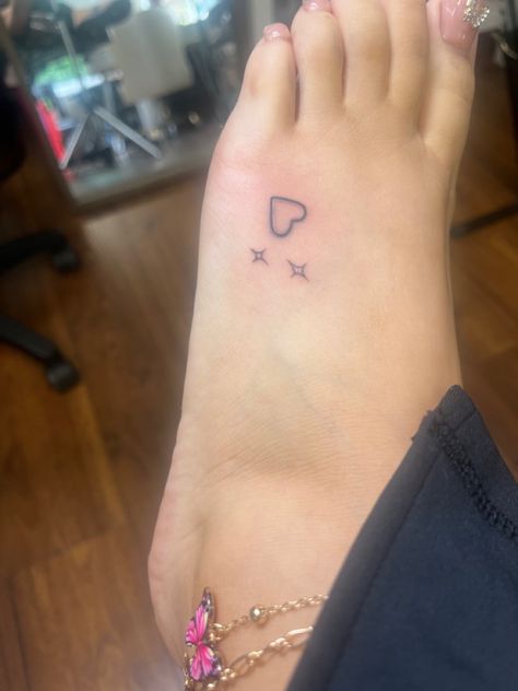 Small Hearts And Stars Tattoo, Heart Feet Tattoos, Tattoo Ideas On The Ankle, Red Ink Finger Tattoos For Women, Different Color Tattoos, Hand Sparkles Tattoo, Easy Ankle Tattoo, 200s Tattoos, Heart Y2k Tattoo