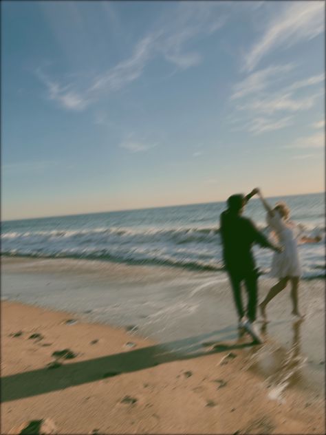 Film photo of couple on beach Beach Life Couple Aesthetic, Beach Wedding Aesthetic Couple, Coastal Couple Aesthetic, Couple Beach Shoot Ideas, Blurry Couple Pics Beach, Film Beach Wedding Photos, Couple Jumping Into Water, Couples Photoshoot Hawaii, Vintage Beach Engagement Photos