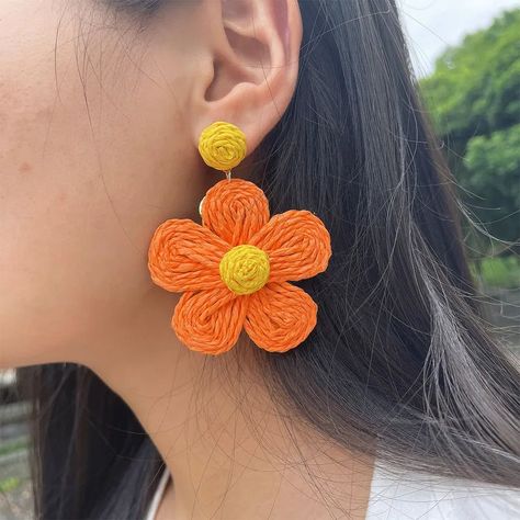 With a resort-ready tropical texture, these statement earrings will be the perfect finishing touch to any spring or summer outfit. They are light weight, has gold toned metal back plating, lead and nickel compliant. ****Pink earring are Pastel Pink, image is slightly darker**** Dimenesions: Approximately 3 in L x 2 in W. Raffia Jewelry, Tropical Flower Design, Rattan Earrings, Rattan Flower, Pink Earring, Green Tassel Earrings, Braid Jewelry, Round Dangle Earrings, Blue Crystal Earrings