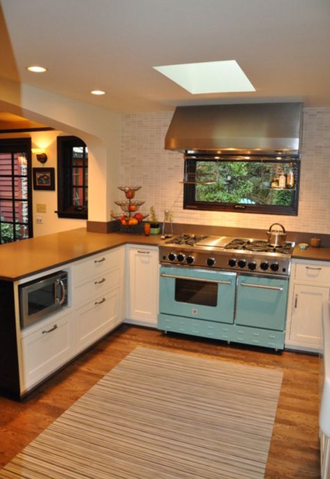 Love the window and range hood above Bluestar stove and hidden microwave in lower cabinet. Stove With Window Above, Stove In Front Of Window Kitchen, Window Behind Stove, Cottage Addition, Cottage Eclectic, Bluestar Range, Stove Design, Stucco House, Stove Hood