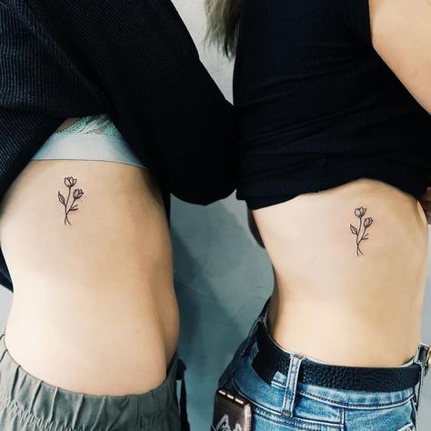 Matching friendship flower tattoos inked on the right rib cage by Cholo Unique Tattoos Black Women, Simple Flower Tattoo, Friendship Flowers, Cage Tattoos, A Tattoo, Matching Best Friend Tattoos, Flower Tattoo Meanings, Cross Tattoos For Women, Friendship Tattoos