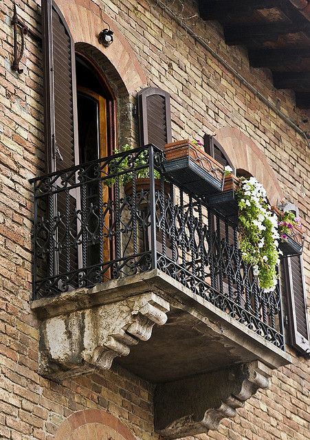 Tuscan balcony, Italy Note:  in US, can use stucco'd foam over framed lumber to replicate the stone corbels. Tuscan Balcony, Style Toscan, Second Floor Balcony, Balcony Railings, Blue Shutters, Iron Balcony, Tuscan Design, Under The Tuscan Sun, Mediterranean Home Decor