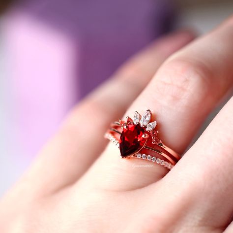 Promise Engagement Wedding Ring Set, Elegant Wedding Rings With Garnet, Elegant Red Crystal Proposal Ring, Red Crystal Promise Ring With Accent Stones, Elegant Garnet Crystal Ring For Wedding, Red Garnet Promise Ring, Red Engagement Ring, Engagement Ring On Hand, Surf Jewelry