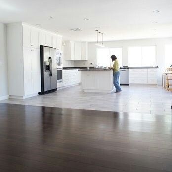 Dark wood to light tile transition. Would work for both Scotty and I. Maybe with dark cabinets since he doesn't like white cabinets. Tile To Wood Transition, Modern Kitchen Flooring, Transition Flooring, Vinyl Flooring Kitchen, Light Hardwood, Wood Floors Wide Plank, Wood Tile Floors, Dark Wood Floors, Kitchen Floor Tile