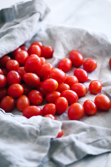 easy, simple, fresh grape tomato sauce by pasta-based. beautiful, bright red, plump grape tomatoes with droplets of water spilling out of a soft linen towel. Grape Tomato Sauce, Vegan Family Dinner, Droplets Of Water, Vegan Sauce Recipes, Shell Pasta Recipes, Shell Pasta, Vegan Sauce, Sauces Recipes, Fresh Tomato Recipes