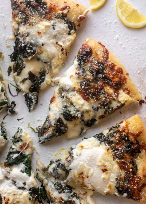 This smoked mozzarella spinach pizza is loaded with flavor. Chewy crust, sautéed spinach with lots of garlic and lemon, smoked mozzarella and ricotta cheese. A dreamy white pizza! Ricotta Pizza, Smoked Mozzarella, Garlic Bread Pizza, Spinach Pizza, Mozzarella Pizza, Large Pizza, Sauteed Spinach, Pizza Bread, Pizza Recipe