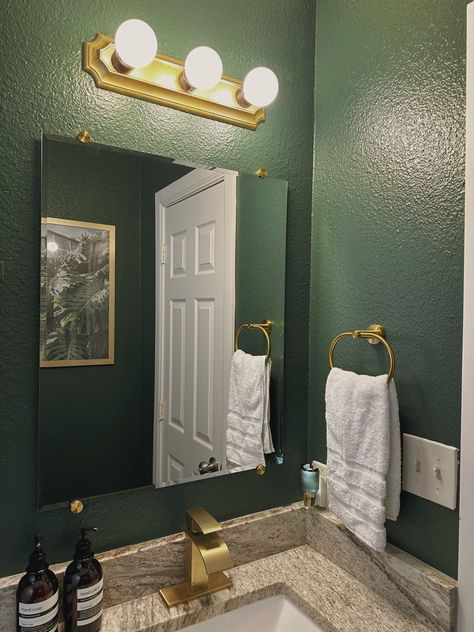 Dark green walls, with gold hardware Emerald Gold Bathroom, Dark Green And Gold Decor, Dark Green And Gold Bathroom Ideas, Green Black And Gold Bathroom, Black And Green Apartment Aesthetic, Green And Silver Bathroom, Dark Green And Gold Bathroom, Emerald Green And Gold Bathroom, Gold And Green Bathroom