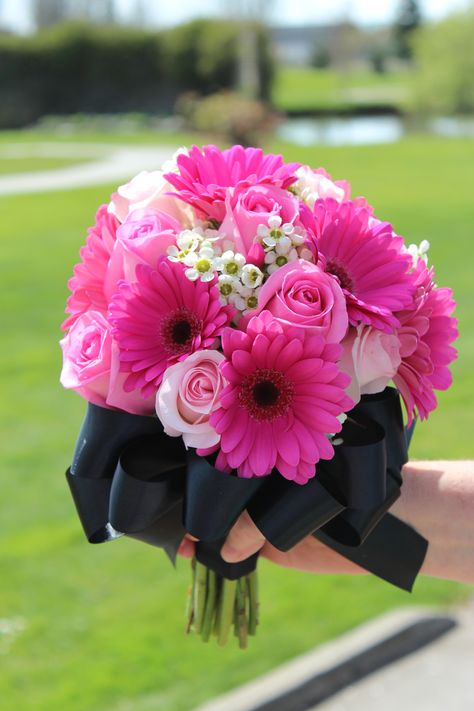 pink wedding flowers.  pink and black wedding.  Hot pink gerbera daisies, pink roses, accented with white wax flowers. Hot Pink And Black Bouquet, Hot Pink And Black Wedding Theme, Hot Pink Prom Bouquet, Hot Pink Wedding Flowers, Hoco Flowers, Pink And Black Wedding, Prom Flowers Bouquet, Wedding Flowers Pink, Hoco 2023