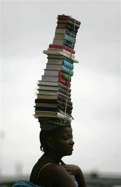 Rabih Alameddine on Twitter: "A woman carries books for sale in Luanda, Angola. © Rafael Marchante.… " Carry On Book, Michel De Montaigne, By Any Means Necessary, People Reading, Book Community, Love Of Reading, We Are The World, All About Books, World Of Books