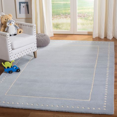 Lend plush comfort to your decor with this stylish area rug. Hand-tufted from wool, the area rug features a double border design with a solid stripe interior border, and an abstract dot exterior border. Light Blue Nursery Boy, Nursery Rugs Boy, Art Motifs, Nursery Boy, Boys Nursery, Solid Color Rug, Blue Nursery, Twins Room, Ivory Area Rug