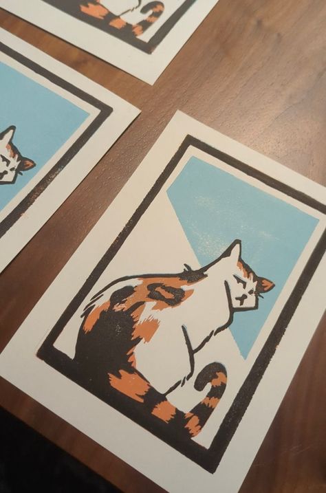 This is a limited series of linocut prints featuring the most gorgeous of creatures, the calico cat. Meticulously handcrafted, each print captures the grace and vibrant beauty of the beloved feline companion. With only a limited number available, this artwork is a cherished find for cat and art enthusiasts alike. Add a touch of elegance to your space or surprise a loved one with this captivating piece of feline-inspired art. Cat Linocut, Magnolia Print, Stamp Carving, Gift For Cat Lover, Cat Owner, Calico Cat, The Grace, Linocut Prints, Cat Owners