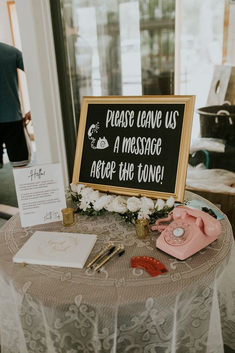 Danielle and Cody used After the Tone, the best audio guest book out there - selecting an antique pink rotary phone for their guests to use to leave audio messages for them instead of writing in a guest book. We loved this choice! For more of this Wisconsin Camp Wedding, explore the blog.  Photo by Chloe Ann Photography #afterthetone #audioguestbook #wisconsinwedding Wedding Leave A Message Ideas, Wedding Guest Book Phone, Guest Book And Card Table Wedding, Audio Guest Book Table, Wedding Reception Guest Book Ideas, Phone Guest Book, Wedding Voicemail Guest Book, Wedding Phone Guest Book, At The Tone Guest Book