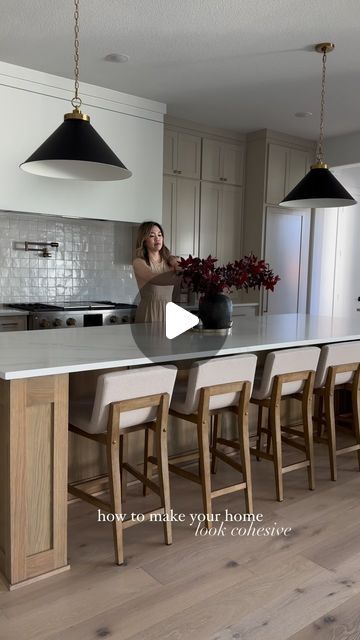 Cindy Nguyen on Instagram: "How do I make my home look cohesive? 

To avoid having your home looking too matching yet still cohesive, it’s good to let your decor evolve. Let your decoration flow over time. 

I love a relatively neutral balance. Choose a go-to color and place it in every room. Since my great room, dining, and kitchen is all in one open space, I chose medium wood tones, beige, and black with brass. 

Know your vibe & pursue this style throughout! 

Follow along with me @transitionalmodernhome for more home, design, and building inspo! 🫶🏻

Comment SHOP below to receive a DM with the link to shop this post on my LTK ⬇ https://liketk.it/4TkiY

Other ways to shop my home is head to my link in my bio to shop my LTK and Amazon storefront! 

#neutralhome #homeinspo #buildinginspo Kitchen To Living Room Transition, Room Transition, Wood Tones, Amazon Storefront, Beige And Black, Great Room, Dining And Kitchen, Home Look, Open Space